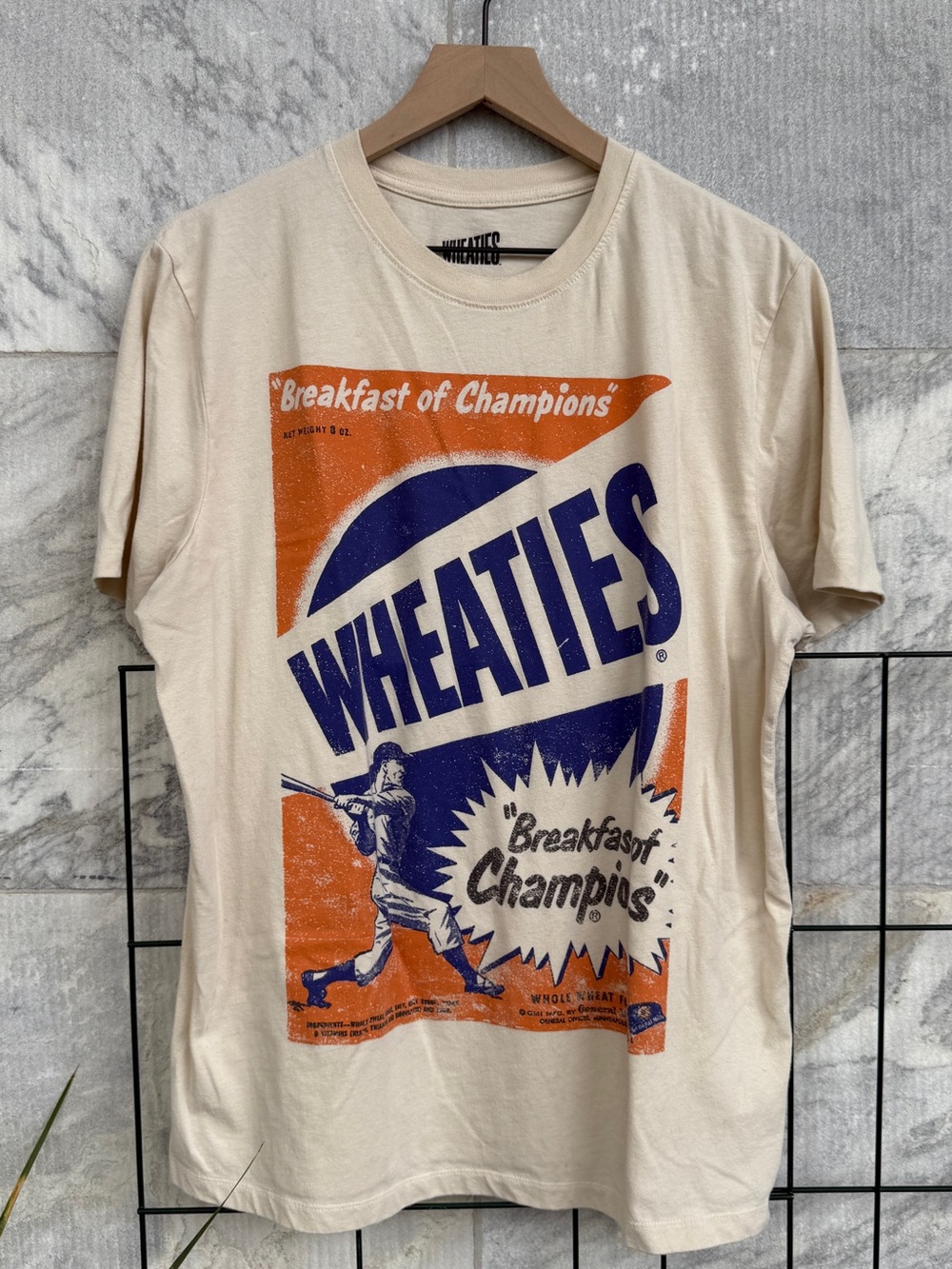 Wheaties Graphic Tee - Cream with Orange & Blue Print